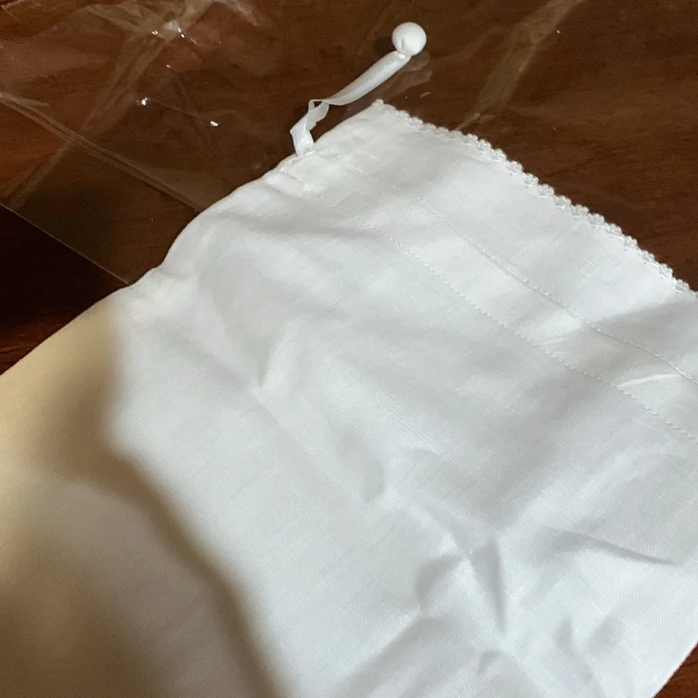 And beautiful hand made rare linen pouch with letter N hand dawn. Brand new!